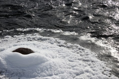 small rock in big river